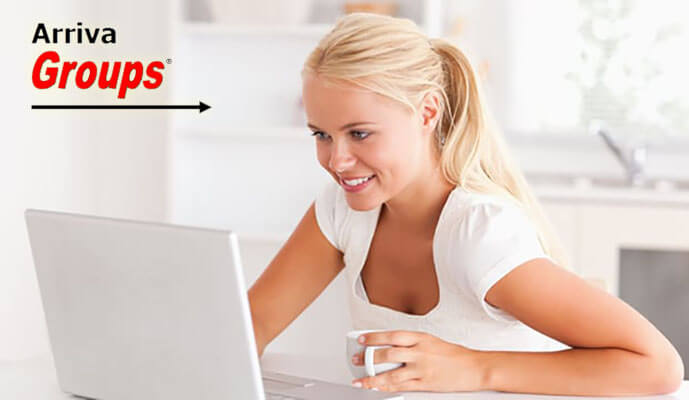 Picture of a blonde woman researching on her computer.