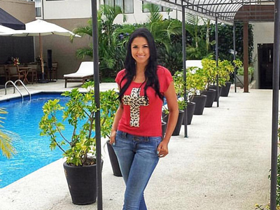 Picture of a guest standing beside the pool at the Costa Rica Medical Center Inn, San Jose, Costa Rica.