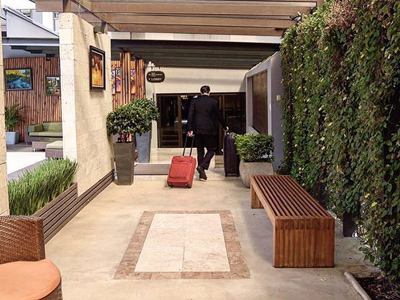 Picture of a porter delivering luggage to a room at the Costa Rica Medical Center Inn, San Jose, Costa Rica.