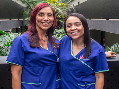 Picture two smiling caregivers at the Costa Rica Medical Center Inn, San Jose, Costa Rica.