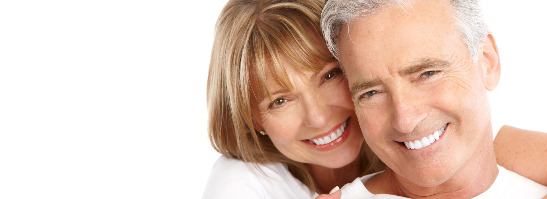 Picture of a happy man and woman smiling at the camera, and happy with their ArrivaGroups deal.